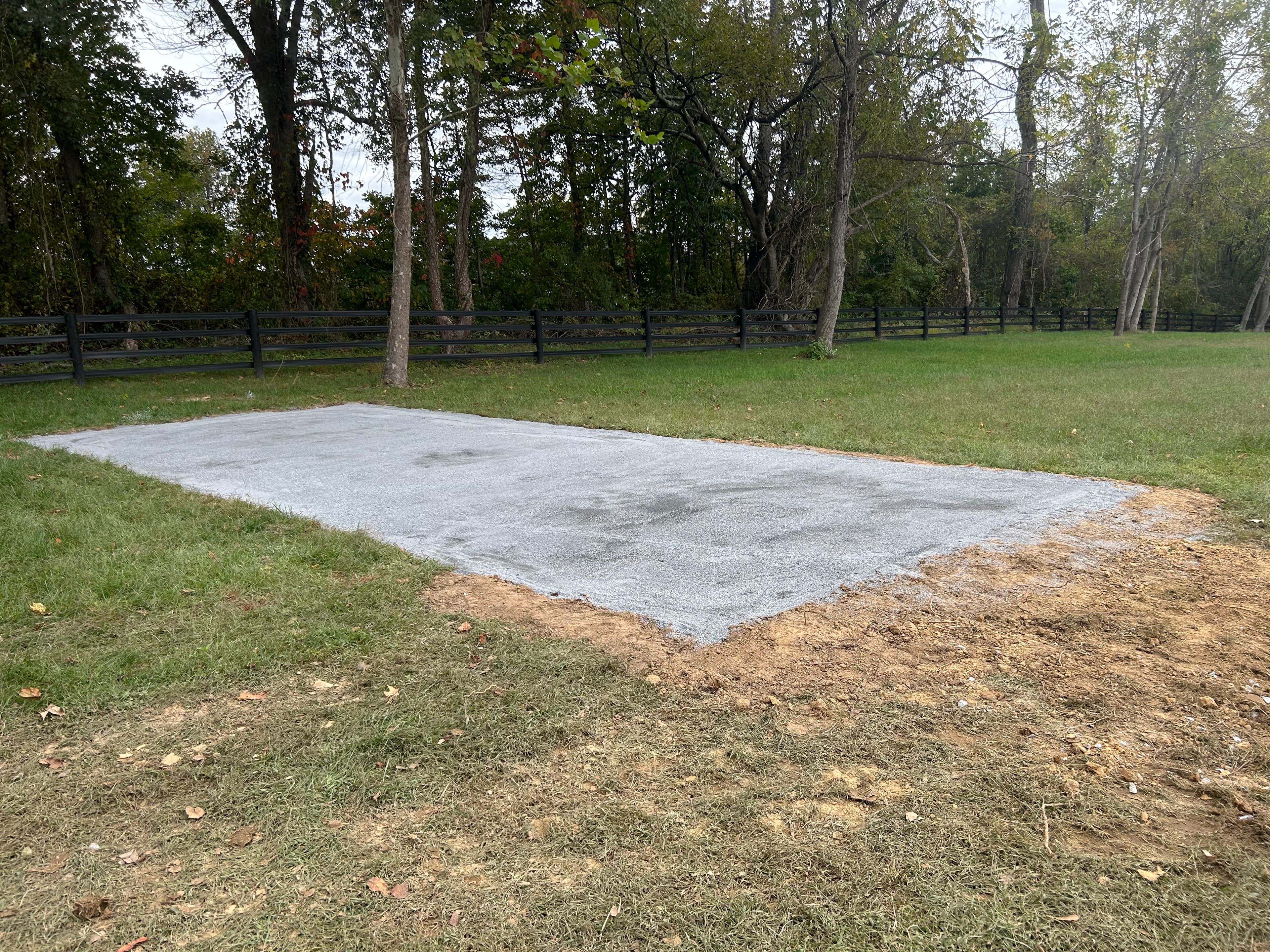 Large stone dust gravel pad for horse barn on rural Maryland property