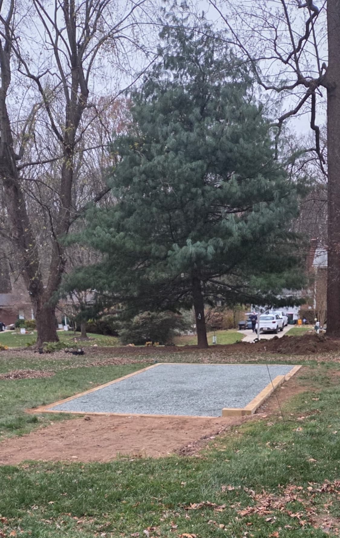 Timber-framed gravel pad on wooded lot in fall — Anne Arundel County