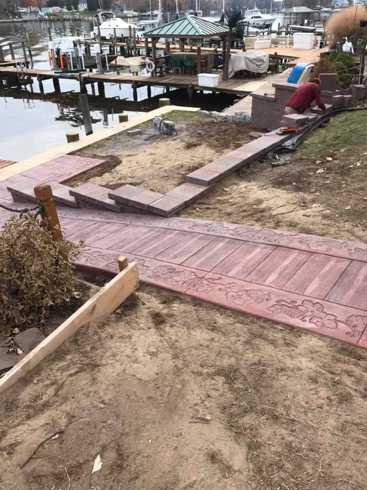 Stamped walkway and paver patio at marina waterfront property
