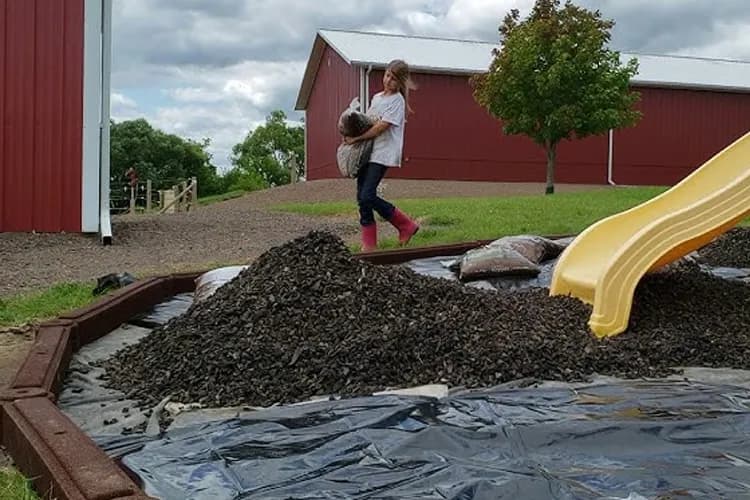 Gravel pad foundation prepared for shed installation