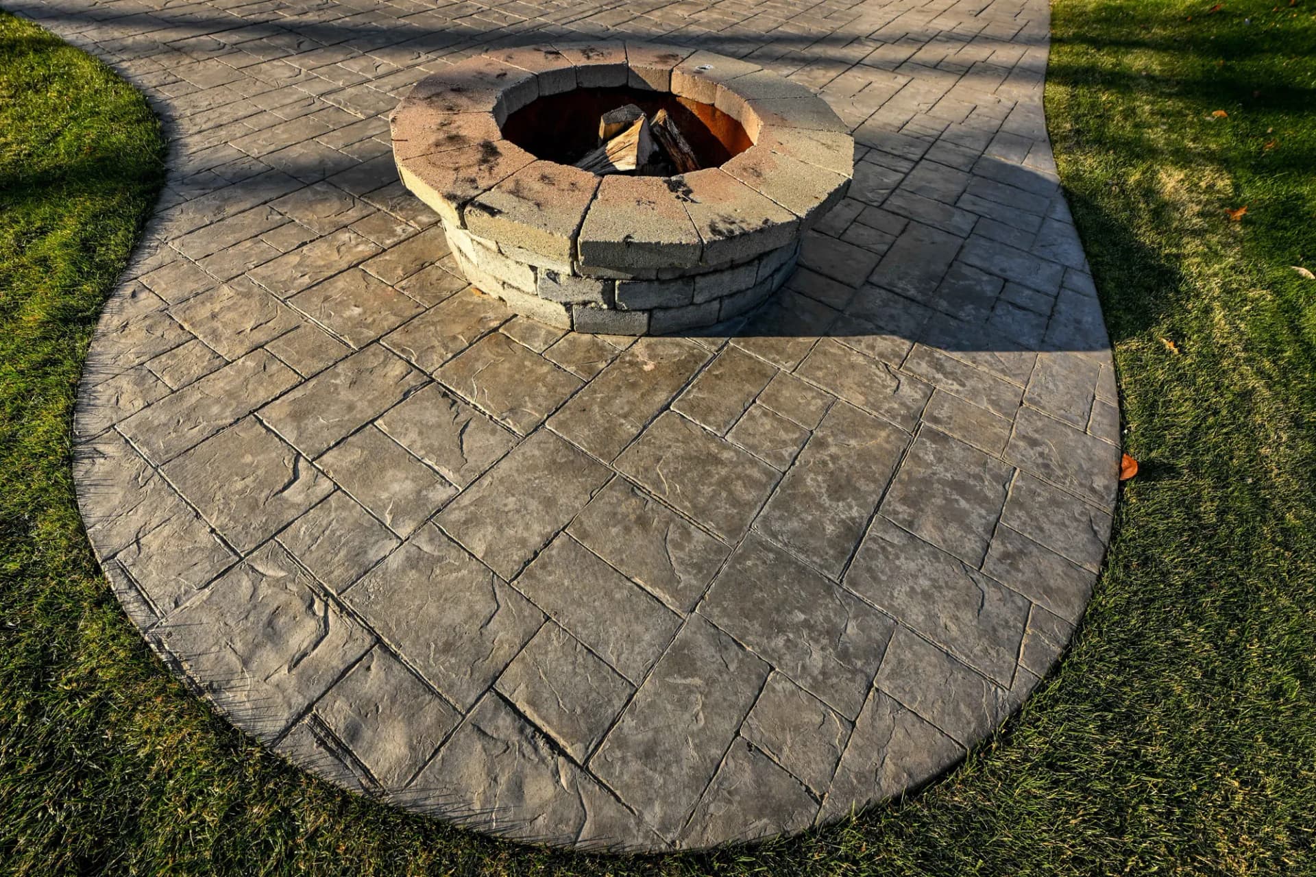 Stamped concrete patio by Backyard Bobby's